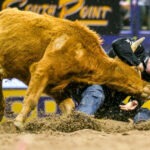 Hermiston’s Dalton Massey secures a blazing-fast 3.5-second run to win the first round of steer wrestling at the 2023 NFR